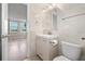 Bathroom featuring a modern vanity, decorative lighting, and a view from the doorway at 2017 Skimmer W Ct # 416, Clearwater, FL 33762