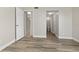 Neutral bedroom with doors to other rooms and wood-look flooring at 2017 Skimmer W Ct # 416, Clearwater, FL 33762