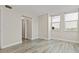 Bright bedroom featuring wood-look flooring and ample natural light at 2017 Skimmer W Ct # 416, Clearwater, FL 33762