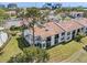 Condominium exterior featuring large windows, balconies, and mature landscaping for privacy at 2017 Skimmer W Ct # 416, Clearwater, FL 33762