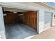 Open garage space with interior wood framing and an overhead light at 2017 Skimmer W Ct # 416, Clearwater, FL 33762