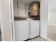Laundry closet equipped with a washer, dryer, and water heater at 2017 Skimmer W Ct # 416, Clearwater, FL 33762