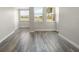 Bright living room featuring wood-look flooring and ample natural light with a view at 2017 Skimmer W Ct # 416, Clearwater, FL 33762
