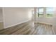 Bright living room featuring wood-look flooring and ample natural light with a view at 2017 Skimmer W Ct # 416, Clearwater, FL 33762