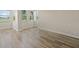 Bright living room featuring wood-look flooring and ample natural light with a view at 2017 Skimmer W Ct # 416, Clearwater, FL 33762