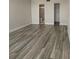 Bright main bedroom featuring wood-look flooring with an ensuite bathroom at 2017 Skimmer W Ct # 416, Clearwater, FL 33762