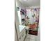 Cozy bathroom featuring a decorative shower curtain and a single sink vanity at 2114 W Hanna Ave, Tampa, FL 33604