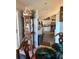 Dining area leading to a bright kitchen with white cabinetry at 2114 W Hanna Ave, Tampa, FL 33604