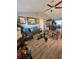 Comfortable living room with hardwood floors, sofas and view to a dining room at 2114 W Hanna Ave, Tampa, FL 33604