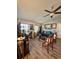 Bright living area with vaulted ceilings, ceiling fan, luxury vinyl plank flooring, and lots of natural light at 2114 W Hanna Ave, Tampa, FL 33604