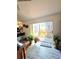 Bright living area with sliding glass doors to the backyard deck and laminate flooring at 2114 W Hanna Ave, Tampa, FL 33604