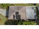 Aerial view of the roof with solar panels and screened pool enclosure at 301 1/2 Shore E Dr, Oldsmar, FL 34677