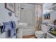 Cozy bathroom with a tiled shower and tub combination and pedestal sink at 301 1/2 Shore E Dr, Oldsmar, FL 34677