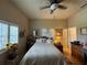 Inviting bedroom with a queen size bed and shuttered windows at 301 1/2 Shore E Dr, Oldsmar, FL 34677