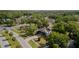 A charming home featuring well-maintained landscaping and mature trees providing shade at 301 1/2 Shore E Dr, Oldsmar, FL 34677