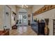 Elegant foyer features tile floors, Asian decor and artwork, and a glass front door at 301 1/2 Shore E Dr, Oldsmar, FL 34677