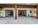 View of the open garages featuring storage space and exterior features at 301 1/2 Shore E Dr, Oldsmar, FL 34677