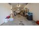 Spacious two car garage with overhead lighting, perfect for storage and organization at 301 1/2 Shore E Dr, Oldsmar, FL 34677