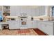 Efficient kitchen space features white cabinets, modern appliances, and functional layout at 301 1/2 Shore E Dr, Oldsmar, FL 34677