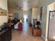 Open-concept living area featuring neutral tones, tile floors, and stylish furnishings for a comfortable atmosphere at 301 1/2 Shore E Dr, Oldsmar, FL 34677