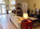 Comfortable living room with large tile floors and cozy decor at 301 1/2 Shore E Dr, Oldsmar, FL 34677