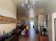 Inviting living room with tile floors, a ceiling fan, and large windows offering ample natural light at 301 1/2 Shore E Dr, Oldsmar, FL 34677