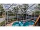 Charming outdoor bar area with seating, ideal for entertaining guests and enjoying the backyard view at 301 1/2 Shore E Dr, Oldsmar, FL 34677