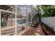 Relaxing screened-in pool area with inviting lounge chairs and a privacy fence at 301 1/2 Shore E Dr, Oldsmar, FL 34677