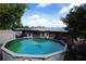 This backyard features a above-ground pool at 3302 Eisenhower Dr, Holiday, FL 34691