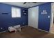 This bedroom features a ceiling fan and closet at 3302 Eisenhower Dr, Holiday, FL 34691
