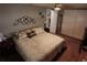 This bedroom features a comfortable bed with decorative pillows and an 'I love us' throw pillow at 3302 Eisenhower Dr, Holiday, FL 34691