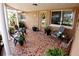 Inviting front porch featuring a tile floor, seating area, and a decorated front door at 3302 Eisenhower Dr, Holiday, FL 34691