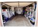 The garage is well-organized with shelves, laundry machines, and has a 'for sale' sign on the refrigerator at 3302 Eisenhower Dr, Holiday, FL 34691