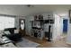 Inviting living area with comfortable seating, TV, and access to a hallway at 3302 Eisenhower Dr, Holiday, FL 34691