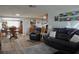 Open living space with a dining area, a sofa, and light-colored wood floors at 3302 Eisenhower Dr, Holiday, FL 34691