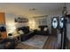 Comfortable living room with plush seating, soft lighting, and a decorative rug at 3302 Eisenhower Dr, Holiday, FL 34691