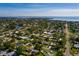 Wide aerial view of a coastal neighborhood, highlighting the property's location near the water and community amenities at 4126 Carson Ne St, St Petersburg, FL 33703