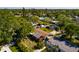 Aerial view of residential home with lush landscaping, driveway, and surrounding neighborhood at 4126 Carson Ne St, St Petersburg, FL 33703