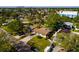Aerial view of a home with a well manicured lawn and mature trees at 4126 Carson Ne St, St Petersburg, FL 33703