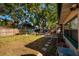 The backyard is spacious and fenced, with mature trees providing ample shade at 4126 Carson Ne St, St Petersburg, FL 33703