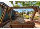 Spacious backyard with a stone patio, swing set, and outdoor seating area perfect for entertaining at 4126 Carson Ne St, St Petersburg, FL 33703