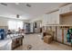 Spacious living room with large windows, tile flooring, and white cabinets at 4126 Carson Ne St, St Petersburg, FL 33703