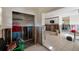 Open living room with tile floor and storage at 4126 Carson Ne St, St Petersburg, FL 33703