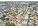 Aerial view of a waterfront home in a neighborhood with canals and mature landscaping near Maximo Marina at 4395 50Th S Ter, St Petersburg, FL 33711