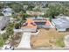 Aerial view of a single Gathering home featuring a solar-paneled roof and fenced-in pool area at 4395 50Th S Ter, St Petersburg, FL 33711