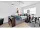 This bedroom is well-appointed with a work space, bed with storage, and musical instruments at 4395 50Th S Ter, St Petersburg, FL 33711