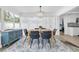 Elegant dining room featuring a modern chandelier, dining table, and bright windows at 4395 50Th S Ter, St Petersburg, FL 33711