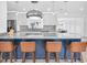 Stylish kitchen with blue island, marble countertops, stainless steel appliances, and pendant lighting at 4395 50Th S Ter, St Petersburg, FL 33711