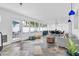 Spacious living area with tile flooring, ample windows, and a view to the outdoor patio and dining area at 4395 50Th S Ter, St Petersburg, FL 33711