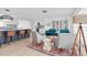 Open living area with a kitchen island, sofa, chairs, and modern decor at 4395 50Th S Ter, St Petersburg, FL 33711